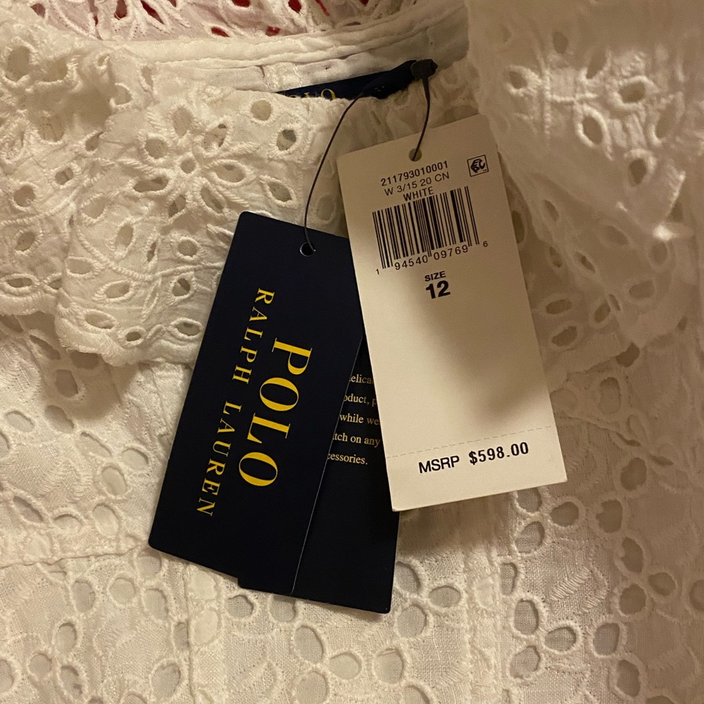 Elegant summer eyelet dress. Fitted bodice and full skirt for special occasion.